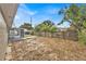 Overlooking the backyard with a wooden fence at 1609 Seneca Ave, Lakeland, FL 33801