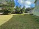 Another view of the backyard with green grass at 161 Bolender Rd, Auburndale, FL 33823