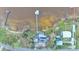 Bird's eye view of house, dock, and surrounding landscape at 1769 S Lake Reedy Blvd, Frostproof, FL 33843