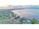 Aerial view of waterfront homes and properties along a calm lake at 1769 S Lake Reedy Blvd, Frostproof, FL 33843
