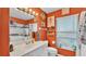 Clean bathroom with white vanity and orange walls at 1769 S Lake Reedy Blvd, Frostproof, FL 33843