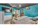 Bedroom with fireplace, en-suite bathroom, and TV at 1769 S Lake Reedy Blvd, Frostproof, FL 33843