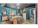 Bright bedroom with a unique gold canopy bed frame and blue walls at 1769 S Lake Reedy Blvd, Frostproof, FL 33843