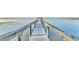 Long private wooden dock extending to a covered boat slip at 1769 S Lake Reedy Blvd, Frostproof, FL 33843