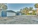 Long driveway leading to house and detached garage at 1769 S Lake Reedy Blvd, Frostproof, FL 33843