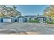 House exterior with dark gray paint, solar panels, and detached garage at 1769 S Lake Reedy Blvd, Frostproof, FL 33843