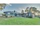 House exterior with solar panels and large yard at 1769 S Lake Reedy Blvd, Frostproof, FL 33843