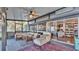 Relaxing screened porch with wicker furniture and view at 1769 S Lake Reedy Blvd, Frostproof, FL 33843