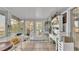 Bright sunroom with water views and workspace at 1769 S Lake Reedy Blvd, Frostproof, FL 33843