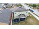 Aerial view of two-story house, backyard, and trampoline at 2002 Honeybell Ave, Haines City, FL 33844