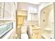 Clean bathroom with shower/tub combo, vanity, and window at 2036 Lake Ariana Blvd, Auburndale, FL 33823