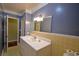 Bright bathroom with vanity and access to other rooms at 2036 Lake Ariana Blvd, Auburndale, FL 33823