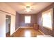 Charming bedroom with hardwood floors, ceiling fan, and window at 2036 Lake Ariana Blvd, Auburndale, FL 33823