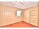 Cozy bedroom with built-in shelving and ceiling fan at 2036 Lake Ariana Blvd, Auburndale, FL 33823