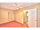 Well-lit bedroom with access to hallway and closet at 2036 Lake Ariana Blvd, Auburndale, FL 33823