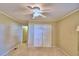 Spacious bedroom with large closet and ceiling fan at 2036 Lake Ariana Blvd, Auburndale, FL 33823