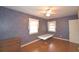 Bright bedroom with hardwood floors, ceiling fan and window at 2036 Lake Ariana Blvd, Auburndale, FL 33823