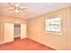 Bright bedroom featuring a ceiling fan and spacious closet at 2036 Lake Ariana Blvd, Auburndale, FL 33823