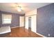 Well-lit bedroom with hardwood floors and a ceiling fan at 2036 Lake Ariana Blvd, Auburndale, FL 33823