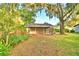 Single car garage with covered carport and open space at 2036 Lake Ariana Blvd, Auburndale, FL 33823