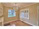 Dining room with hardwood floors and built-in shelving at 2036 Lake Ariana Blvd, Auburndale, FL 33823