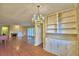 Bright dining room features built-in shelving and hardwood floors at 2036 Lake Ariana Blvd, Auburndale, FL 33823