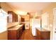 Kitchen with wood cabinets and white appliances at 2036 Lake Ariana Blvd, Auburndale, FL 33823