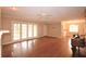 Spacious living room with hardwood floors and a piano at 2036 Lake Ariana Blvd, Auburndale, FL 33823