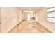 Spacious living room featuring hardwood floors and a view of the backyard at 2036 Lake Ariana Blvd, Auburndale, FL 33823