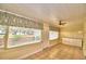Sunroom with water views and tiled floor at 2036 Lake Ariana Blvd, Auburndale, FL 33823