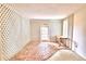 Bright sunroom with brick flooring and lattice walls, leading to the outdoors at 2036 Lake Ariana Blvd, Auburndale, FL 33823