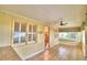 Bright sunroom with tiled floors and ceiling fan at 2036 Lake Ariana Blvd, Auburndale, FL 33823