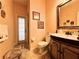 Bathroom with a vanity, toilet and access to another room at 228 Santa Rosa Dr, Winter Haven, FL 33884