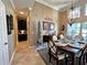 Formal dining room with wood table, chandelier, and decorative accents at 228 Santa Rosa Dr, Winter Haven, FL 33884