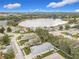 Community overview showcasing houses near a lake at 235 Lake Suzanne Dr, Lake Wales, FL 33859