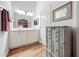 Bathroom with white cabinets, a vanity with a marble countertop, and a shower at 235 Lake Suzanne Dr, Lake Wales, FL 33859