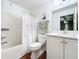 Clean bathroom with a shower/tub combo and a white vanity at 235 Lake Suzanne Dr, Lake Wales, FL 33859