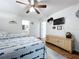 Bedroom with two twin beds, a ceiling fan and a dresser at 235 Lake Suzanne Dr, Lake Wales, FL 33859