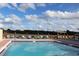 Relaxing community pool with lounge chairs at 235 Lake Suzanne Dr, Lake Wales, FL 33859