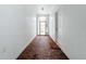 Clean entryway with brick flooring and a view to the backyard at 235 Lake Suzanne Dr, Lake Wales, FL 33859