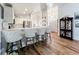 Kitchen with breakfast bar, white cabinets, and quartz countertops at 235 Lake Suzanne Dr, Lake Wales, FL 33859