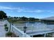 Deck overlooking lake with seating and gazebo at 235 Lake Suzanne Dr, Lake Wales, FL 33859