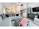 Open living room with a cozy seating area and view of the kitchen at 235 Lake Suzanne Dr, Lake Wales, FL 33859