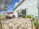 Charming brick patio with seating area, perfect for outdoor relaxation at 235 Lake Suzanne Dr, Lake Wales, FL 33859