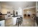 Modern kitchen with white cabinets, an island, and black countertops at 235 Nassau Rd, Winter Haven, FL 33884