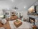 Living room with stone fireplace and hardwood floors at 328 Sunshine Dr, Lake Wales, FL 33859