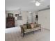 Living room with hardwood floors, a sofa, and a view into the kitchen at 3421 Grenville Dr, Winter Haven, FL 33884