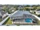 Aerial view of house with pool and screened enclosure at 357 Magneta Loop, Auburndale, FL 33823