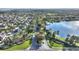 Aerial view of community with lake and homes at 357 Magneta Loop, Auburndale, FL 33823