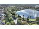 Aerial view of community entrance and lake at 357 Magneta Loop, Auburndale, FL 33823